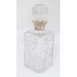 Golf Interest : A cut glass decanter with etched golfing scene decoration with silver collar