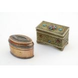An early 20thC small rectangular hinged box with filigree style decoration and turquoise and