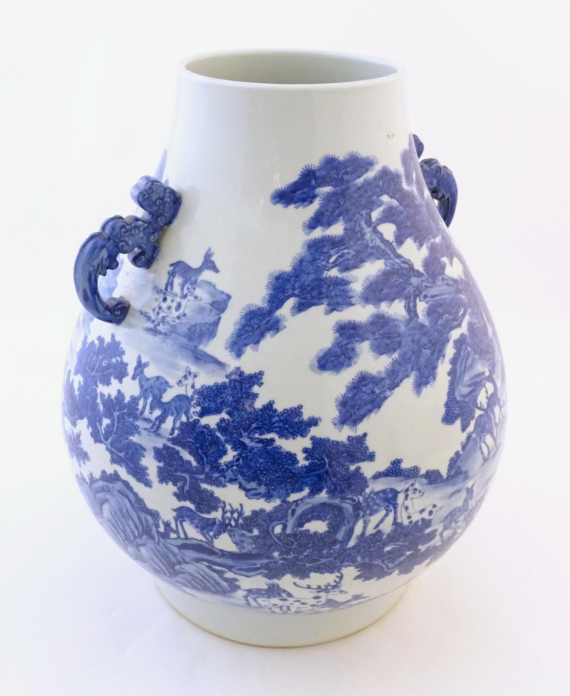 A large Chinese Hu vase with scrolled twin handles, the body decorated in blue and white with the - Image 3 of 9