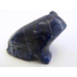A carved lapis lazuli model of a frog. Approx. 1" high. Please Note - we do not make reference to