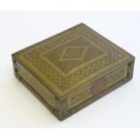 An Arts & Crafts brass box of rectangular form with engraved banded decoration, and an inset
