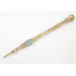 A late 19th / early 20thC yellow metal retractable pencil with engraved foliate decoration and