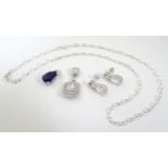 Assorted silver jewellery comprising pendants earrings and a chain. The chain approx. 18" long (4)