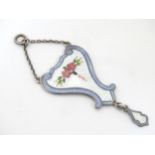 An Art Nouveau silver and guilloche enamel pendant necklace, with floral detail to centre.