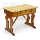 A 19thC pine Victorian table with a rectangular top above single long drawer with turned wooden