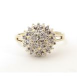 A 9ct gold ring set with cluster of diamonds to top. Ring size approx. L Please Note - we do not