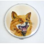 A silver powder compact with enamel fox head decoration to lid, hallmarked Birmingham 1940, maker