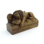 An early 20thC carved wooden model of the lion of Lucerne after Bertel Thorvaldsen (1770-1844), with
