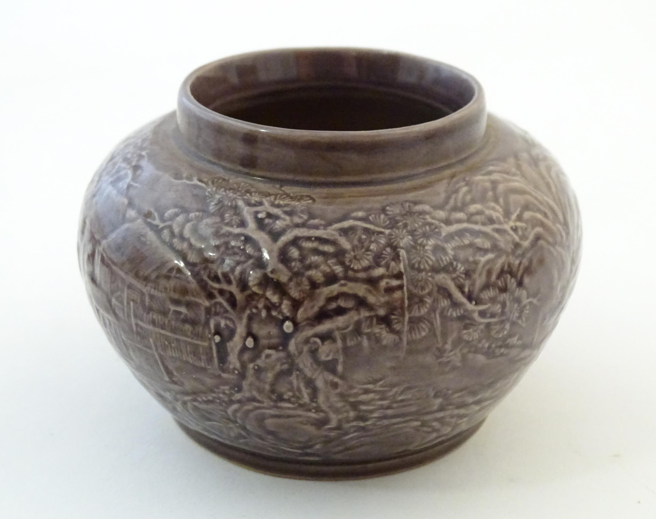 A small Chinese pot of squat form with cast landscape detail. Character marks under. Approx. 2 1/ - Image 4 of 6