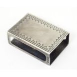 A silver match box cover with engraved decoration, hallmarked Birmingham 1920, maker R Gaunt & Son .