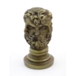 A 19thC French cast hand / desk seal modelled as a six sided Classical head, the intaglio seal