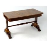 A mid 19thC mahogany library desk with a rectangular top above two shaped supports united by a cross
