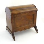 A 19thC rosewood Canterbury with a domed top, shaped sides and having chamfered legs above porcelain