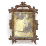 A 20thC carved wooden photograph frame in the black forest style. Approx. 9" x 6" overall Please