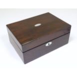 A late 19th / early 20thC mahogany box with hinged lid and oval mother of pearl insert to top.