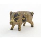 A cold painted bronze model of a pig / boar. Approx. 1 1/4" long Please Note - we do not make