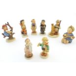 Eight Hummel / Goebel figures comprising Merry Wanderer, no. 11, Chimney Sweep, no. 12, Apple Tree