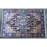 Carpet / Rug : A Nahawand rug, stylised floral motifs and geometric symbols on a ground of blue,