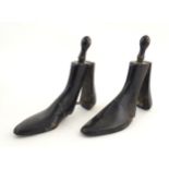 A pair of 20thC shoe trees / lasts, with engraved Rd. no. 619080 and 'Mess', and an applied circular