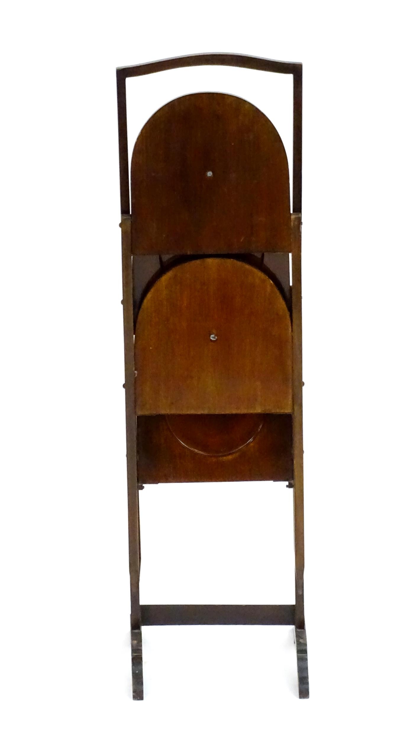 An early 20thC mahogany cake folding cake stand. 34" high. Please Note - we do not make reference to - Image 2 of 4
