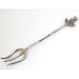 A white metal sweetmeat fork with thistle decoration to handle . Approx. 4 1/2" long Please Note -