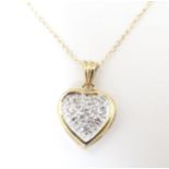 A 9ct gold necklace, the heart shaped pendant set with diamonds. The pendant approx 1/2" long Please
