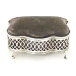 A ring box / jewellery box with hinged velvet top and pierced silver surround and feet, hallmarked