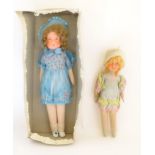 Toys: Two early to mid 20thC cloth and papier mache dolls, the largest approximately 17" long (2)