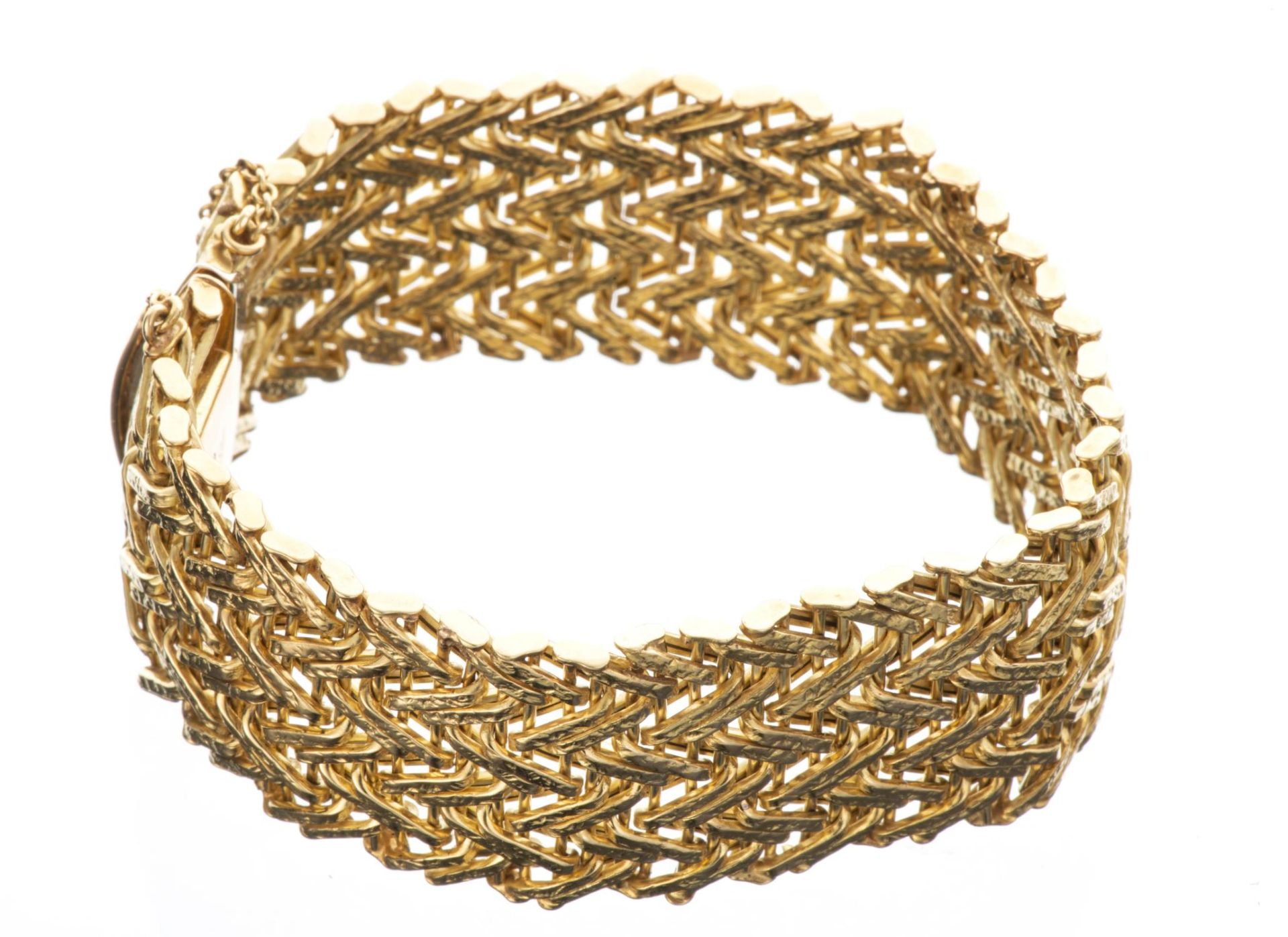 Large bracelet en maille d'or jaune...