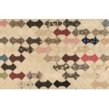 * Quilt. A Victorian tufted patchwork bowtie quilt, English