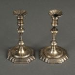 * Candlesticks. A pair of George II silver candlesticks