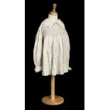 * Infant's clothing. An early child's smock, English, circa 1850, and other children's clothes