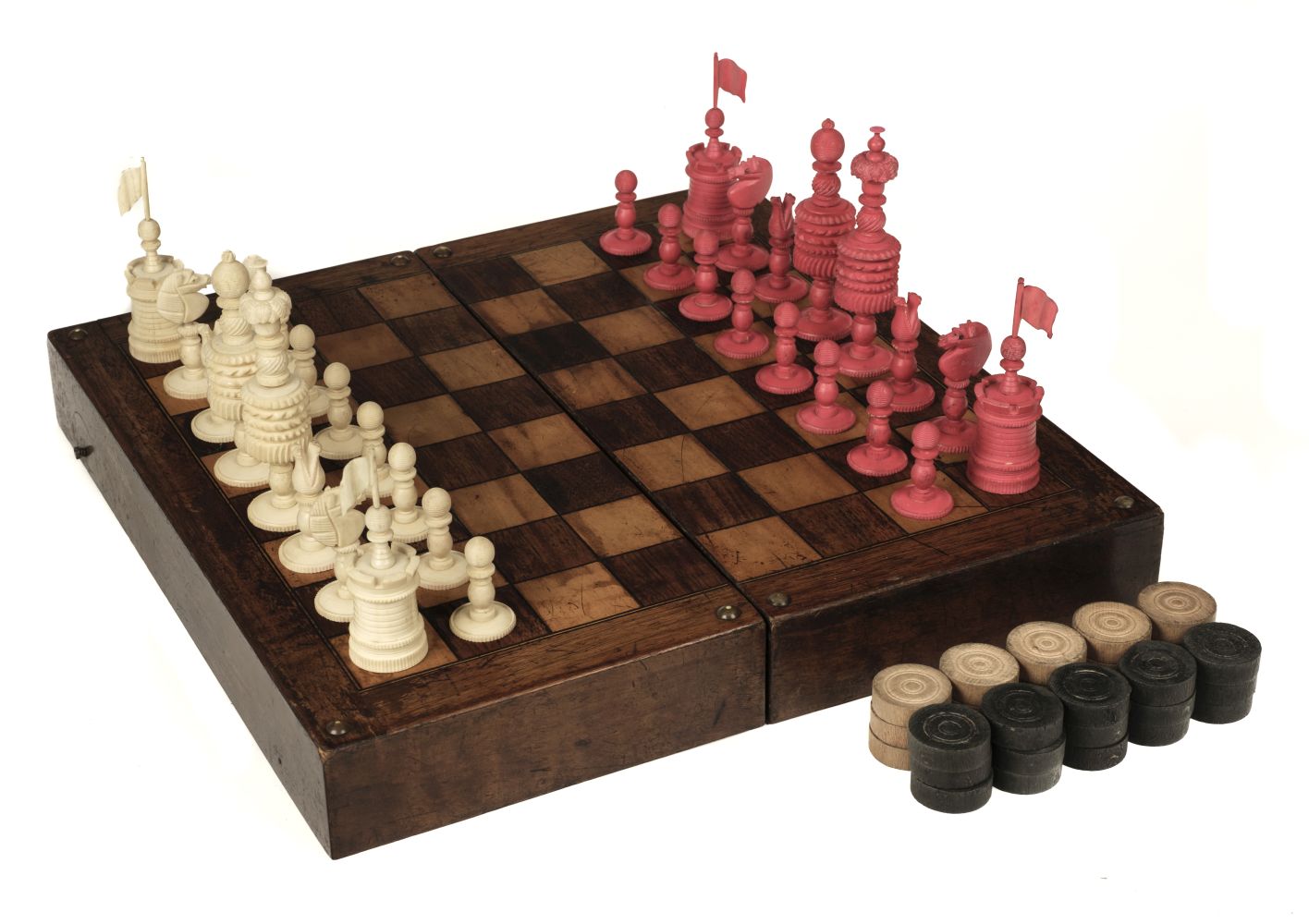 * Chess. A 19th-century English bone chess set carved in the "Barleycorn" pattern