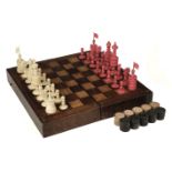 * Chess. A 19th-century English bone chess set carved in the "Barleycorn" pattern