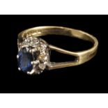 * Ring. An 18ct gold sapphire and diamond cluster ring