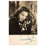 Leigh (Vivien, 1913-1967). A fine vintage black and white photographic postcard signed, 1947