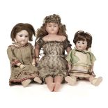 Dolls. A bisque head doll, French, early 20th century, & other dolls and jigsaws