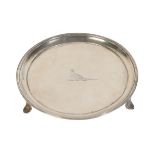 A GEORGE III CIRCULAR SILVER WAITER