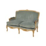 A CARVED, PAINTED AND PARCEL GILT WOOD CANAPE IN LOUIS XV/ XVI TRANSITIONAL STYLE,
