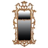 A PAIR OF LARGE CARVED AND GILTWOOD FRAMED WALL MIRRORS, IN ROCOCO TASTE,