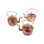 THREE ENGLISH COPPER KETTLES,