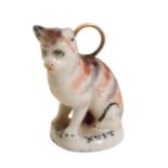 RARE CHELSEA SOFT-PASTE MINIATURE SEAL IN THE FORM OF A CAT, MID 18TH CENTURY