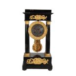 A RESTAURATION EBONIZED PORTICO CLOCK,