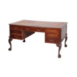 A LEATHER INSET MAHOGANY PARTNERS' DESK, IN GEORGE II TASTE,