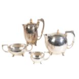 AN ARTS AND CRAFTS FOUR-PIECE SILVER TEA SET,