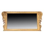 A CARVED GILTWOOD AND COMPOSITION OVERMANTLE MIRROR IN KENTIAN STYLE,