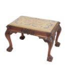 A VICTORIAN CARVED WALNUT AND BERLIN WOOLWORK UPHOLSTERED STOOL, IN GEORGE III STYLE,
