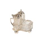 A VICTORIAN THREE-PIECE SILVER MOUNTED GLASS CRUET SET,