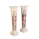 A PAIR OF CARVED AND PAINTED FAUX MARBLE WOOD PEDESTALS,