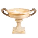 A CONTINENTAL ONYX AND GILT METAL MOUNTED TWIN HANDLED URN,